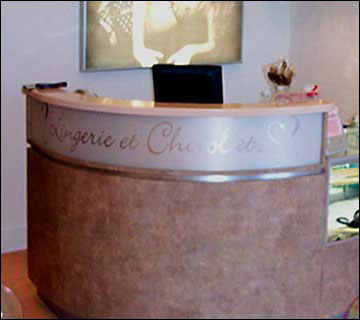 Curved Front with Marble Laminate Logo Front & Pink Corian Ledge. This style counter is an ideal choose when spaces are tight. The curved design gives the counter a stylish look and creates more counter space for both the worker and customer. Add the custom front logo and you truly have a 1 of a kind counter.