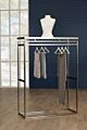 The Moderne double sided apparel rack is the perfect addition to any space. It features a sleek stainless steel, or brass finish with a white high gloss top.  It also includes one level per side.  Dimensions : 51