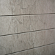 Bleached Cracked Concrete Textured Slatwall Panels measure 3/4''D x 2' Hx 8'L' with grooves spaced 6'' apart.  Textured slatwall panels come complete with paint matched aluminum groove inserts for added strength.  