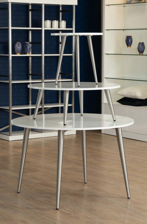 The Moderne round table is a white-topped table with stainless steel or brass finished legs that provide excellent stability and durability.  Dimensions : Small Table: 20" L x20" D x 20" H, Low Table: 35" L x 35" D x 14" H,  and Large Table: 44" L x 47" D
