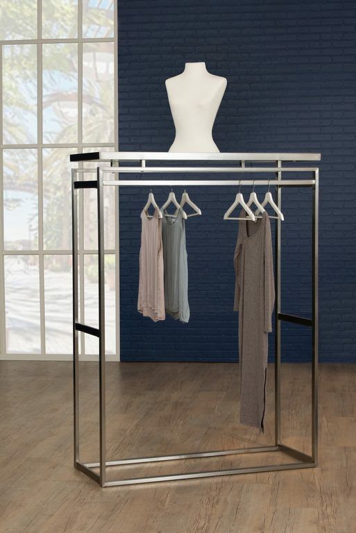 The Moderne double sided apparel rack is the perfect addition to any space. It features a sleek stainless steel, or brass finish with a white high gloss top.  It also includes one level per side.  Dimensions : 51" L x 21" D x 70" H.  