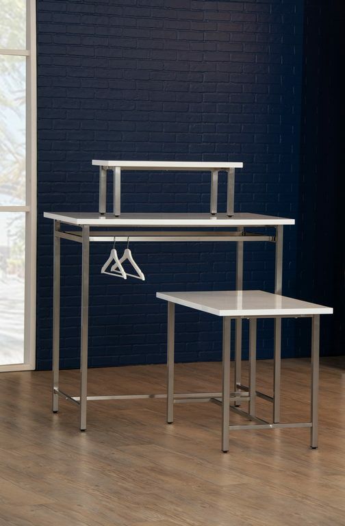 Moderne Nesting Table is crafted from high-quality materials that feature white high gloss table top and  stainless steel. or brass finished legs.  The large table is equipped with two parallel hanging bars on either side of the table, and combine seamles