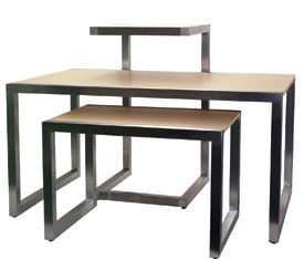 Alta tables are designed to nest together and are the ideal way to present merchandise in stores. Features 2" Square Satin Chrome Frame, 3/4" Maple Hard Rock Melamine Top and includes Levelers.  