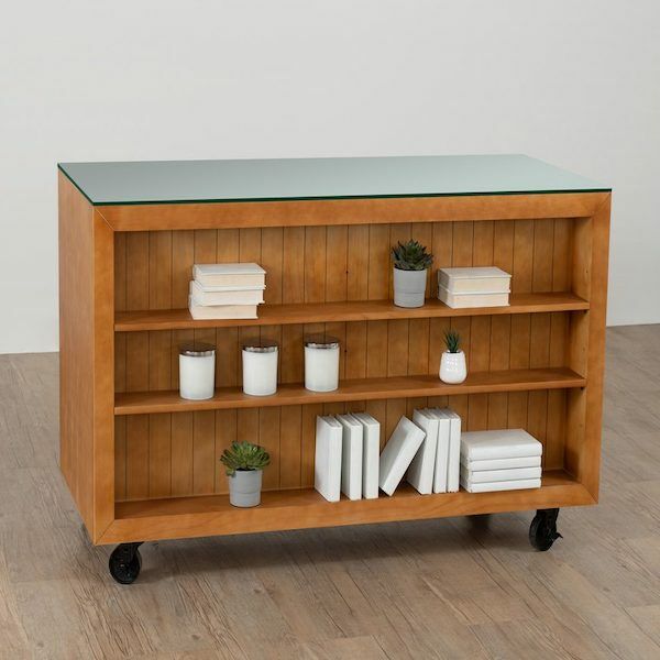 The Soho counter features a distressed pine or white base and glass top, and has convenient rolling casters, making it easy to move around and reposition as needed.  Dimensions : 65 L x 28" D x 38" H. 