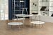 The Moderne round table is a white-topped table with stainless steel or brass finished legs that provide excellent stability and durability.  Dimensions : Small Table: 20" L x20" D x 20" H, Low Table: 35" L x 35" D x 14" H,  and Large Table: 44" L x 47" D