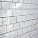 White Subway Tile with Grey Grout Textured Slatwall Panels measure 3/4''D x 2' Hx 8'L' with grooves spaced 6'' apart.  Textured slatwall panels come complete with paint matched aluminum groove inserts for added strength.  Available in white or black finis