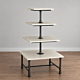 The Soho 4-Tier Square Table comes in a distressed pine or white finish and metal base. This stylish display is perfect for showcasing your merchandise in any retail space and features multiple heights.  Dimensions : 36 L x 36